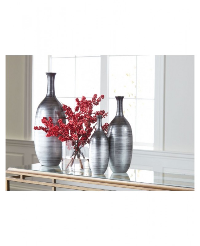 Red holly berries in glass jar