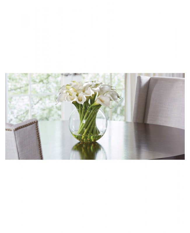 White calla lilies in a round vase