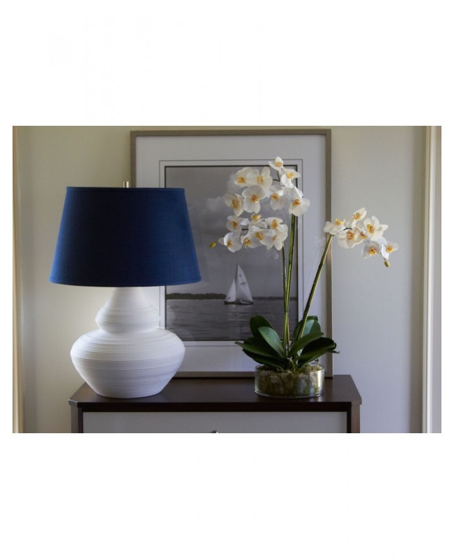 Three-stem white phalaenopsis in a clear glass bowl